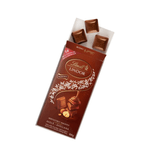 Chocolate-Suico-ao-Leite-com-Pedacos-de-Avelas-Recheio-Cremoso-Lindt-Lindor-100g