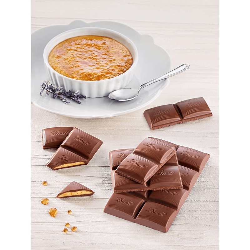 Chocolate-Frances-ao-Leite-Recheio-Creme-Brulee-com-Pedacos-de-Biscoito-Crocante-e-Acucar-Caramelizado-Lindt-Creation-Caixa-150g